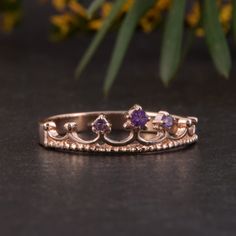 "Crown ring, Gold wedding ring, Amethyst ring, Rose gold ring, Purple stone ring, February birthstone, Women wedding ring, Gold crown ring WE OFFER UNLIMITED PERIOD INSTALLMENTS PLAN This is a beautiful, stunning, feminine ring that works well for all occasions, styles, and ages. You will love it! Ring information: Stone: Amethyst Approximate size: central stone - 2mm, 2 accent stones 1.5mm Metal type: Gold Metal stamp: 14k Gold Customization / Replacements It's easy to create jewelry that's per Rose Gold Amethyst Birthstone Ring For Promise, Rose Gold Amethyst Ring For Promise, Rose Gold Amethyst Ring With Birthstone, Crown Shaped Ring With Prong Setting For Promise, Crown Shaped Promise Rings With Prong Setting, Rose Gold Amethyst Ring With Accent Stones For Anniversary, Rose Gold Amethyst Birthstone Ring, Anniversary Rose Gold Amethyst Ring With Accent Stones, Rose Gold Amethyst Gemstone Ring For Promise