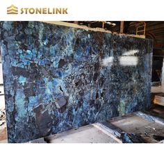 blue granite is being displayed in a warehouse