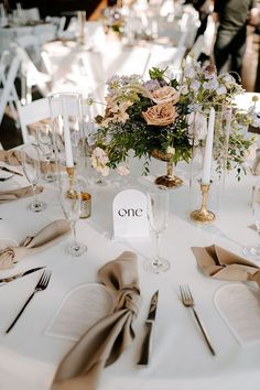 Boho Chic Reception Table Styling with Taupe Napkins and White Linens Transitional Wedding Decor, Boho Wedding Centerpieces With Candles, Candle And Flower Centrepiece, Romantic Table Decor Wedding, Wedding Table With Taper Candles, Wedding Centerpieces Round Table Candles, Wedding Color Beige, Pastel Neutral Wedding, Wedding Decorations Classic Elegant