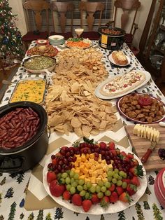 a table filled with lots of food and snacks