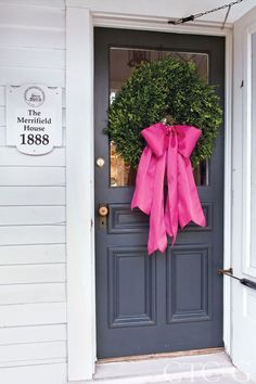 a door with a pink bow on it