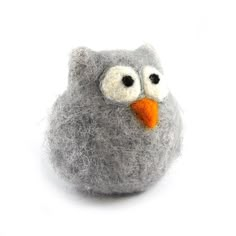 a gray felt owl with an orange beak