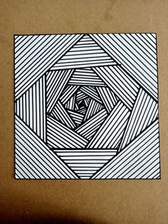 an image of a black and white drawing on paper with lines coming out of it