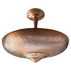 an old fashioned ceiling light with a metal fixture