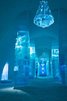 an instagram page with blue ice sculptures and chandelier hanging from the ceiling