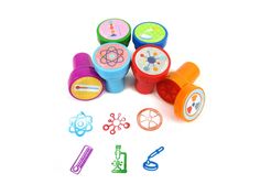 several different colored plastic toys on a white surface