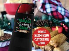 an image of tamale making crew custom name apron on the table with other food items