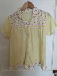 Sweet little vintage baby doll top. lightweight and sheer. Measures flat in inches: 23 long 17 pit to pit 14 shoulder to shoulder  20 across bottom Vintage Lace Trim Tops For Summer, Cute Short Sleeve Tops For Daywear, Vintage Summer Tops With Lace Trim, Vintage Short Sleeve Tops For Daywear, Vintage Summer Sleepwear, Retro Short Sleeve Blouse With Lace Trim, Retro Short Sleeve Sleepwear For Summer, Vintage Sheer Tops For Daywear, Retro Short Sleeve Top With Lace Trim