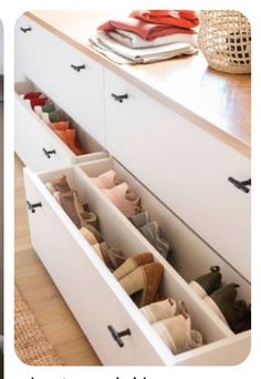 an open drawer with shoes in it and the bottom drawer is filled with slippers