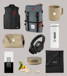 an assortment of items that include headphones, backpacks and coffee mug on a gray background