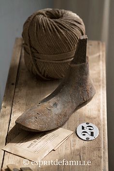 a ball of yarn sitting on top of a wooden table