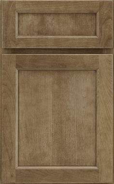 a close up view of the top and bottom of a cabinet door with wood grained finish