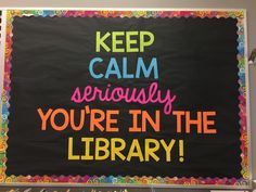 a sign that says keep calm seriously you're in the library