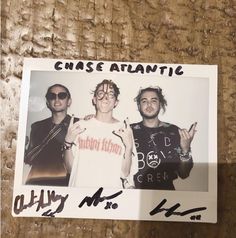 a photo of two men with glasses on and one is holding up the peace sign