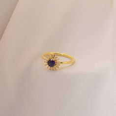 Are you looking for a stunning and elegant piece of jewelry that will elevate your style and leave a lasting impression? Look no further than the Golden Sunflower Ring! Crafted from high-quality 925 sterling silver, this Ring features a vibrant sunflower design with intricate detailing and a delicate round flower Ring at its center. What makes this pendant truly special is the natural Blue Amethyst gemstone that's carefully set within the sunflower design. This stunning stone adds a touch of sop Fine Jewelry Amethyst Halo Ring Gift, Fine Jewelry Amethyst Halo Promise Ring, Fine Jewelry Amethyst Ring With Halo For Promise, Blue Amethyst Ring Elegant Style, Blue Amethyst Elegant Ring, Elegant Amethyst Promise Ring With Open Design, Elegant Purple Gemstone Flower Ring, Elegant Purple Birthstone Ring With Open Design, Elegant Promise Amethyst Open Ring