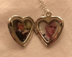 two heart shaped lockes with pictures inside