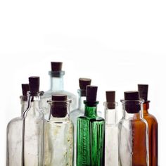 several empty glass bottles lined up in a row