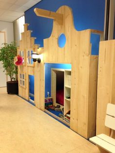 a child's play house made out of wood