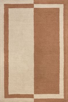 a brown and white rug with squares on it