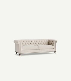 Modeled after its 18th-century forebearer, this button-tufted sofa remains steadfast to the original with handsome nailhead trim and rolled English arms. Its oversized shape and richly hued upholstery transcend the bounds of time, making it a perfect match for contemporary spaces. Ready to elevate your living room experience? Read our comfort guide so you can easily find the perfect sofa for your home, sweet home. | Lyre Chesterfield Two-Cushion Sofa by Anthropologie Button Tufted Sofa, Hanging Furniture, Perfect Sofa, Cushion Sofa, Tufted Sofa, Couch Furniture, Hanging Mirror, Nailhead Trim, Home Sweet Home