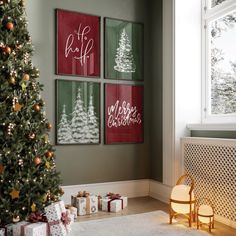 a christmas tree is in front of three framed pictures