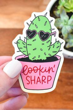 a sticker with the words cookin'sharp in front of a potted cactus