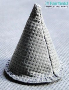 a small white cone sitting on top of a table