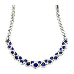 A stunning ladies 18k White Gold Natural Royal Blue Sapphire and Diamond Necklace made in the Province of Alessandra, Italy. The sapphires are Sri Lankan material and custom cut to a perfectly calibrated layout that slightly graduates. The natural round brilliants are collection quality (colorless and VS in clarity). The 16" necklace weighs 60+ grams and contains 303 stones (278 round brilliant diamonds weighing appx 19ct and 25 sapphires weighing appx 18ct). Luxury Sapphire Necklace With Baguette Cut, Luxury Sapphire Single Strand Jewelry, Luxury Gemstone Necklaces With Round Stone, Necklace Blue Stone, Italian Necklace, Royalty Fashion, Boot Jewelry, Colorless Diamond, Royal Jewelry