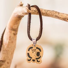 Hand-carved from a piece of coconut shell, the image of the Kawoq sign adorns this necklace from Guatemala, aimed at those blessed by the turtle spirit. Proud of their heritage, Fernando and David fill the cutaway section with lava stone for a sublime contrast, while a leather cord completes the design with comfort. The pendant also represents spiritual union, based on the ancient Mayan doctrine. Spiritual Union, Lava Jewelry, Spiritual Necklace, Ancient Mayan, Brown Jewelry, Necklace Dress, Art Necklaces, Neck Accessories, Mens Jewelry Necklace