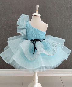 One Shoulder Blue Tutu Dress - Glittery Baby Birthday Dress for Toddler Girls ✨ Unveil the Magic of Blue with Our Enchanting Tutu Dress! ✨ Celebrate your little one's special moments with our gorgeous One Shoulder Blue Tutu Dress. Perfect for birthdays, parties, and other memorable occasions, this elegant dress blends charm and sparkle to create a truly magical experience. 👗 Key Features: Chic Design: This dress showcases a stylish one-shoulder strap and a voluminous tutu skirt enhanced with sh Elegant Blue Holiday Princess Dress, Blue Ruffled Tutu Dress For Dress-up, Blue Princess Dress With Ruffles For Party, Light Blue Ruffled Princess Dress For Party, Blue Tulle Dress For Party, Blue Tutu Dress For Holiday Parties, Blue Princess Dress For Holiday Party, Blue Princess Dress For Pageant Holiday, Blue Spring Party Tutu Dress