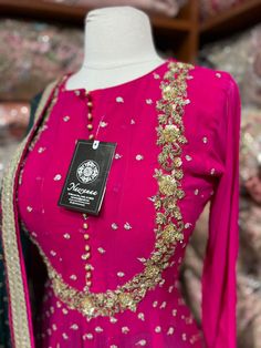 Barbie pink color suit intricate with floral sequence embroidery with zardozi, beads, sequence and zari work. Completed look with dhoti style stone work contrasting olive green pant and georgette dupatta. Fabric: Georgette Size: 40/L Occasion: Wedding Events WASH CARE INSTRUCTIONS - Please Dry clean only when it is applicable. Slight color variation is possible due to photography. Ready to Ship! Pink Embroidered Chinon Salwar Kameez, Designer Pink Embroidered Unstitched Suit, Pink Embroidered Unstitched Suit For Designer Wear, Pink Unstitched Suit With Resham Embroidery For Designer Wear, Pink Bollywood Unstitched Suit In Chinon, Pink Chinon Unstitched Suit For Diwali, Bollywood Style Pink Unstitched Chinon Suit, Traditional Pink Unstitched Suit With Intricate Embroidery, Pink Dola Silk Unstitched Suit With Mirror Work