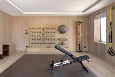 a home gym is shown with an exercise equipment set up in front of the wall