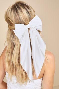 Adding a piece like the Lulus Adorable Inclusion White Satin Bow Hair Clip to any 'fit will instantly enhance the romantic vibes! This ultra-femme accessory features a sleek satin bow that boasts a layered design and long elegant tails, all atop a silver alligator clip-style closure. From the rehearsal dinner to the big day, this darling bow will add a charming touch to any look. Bow Measures 7" Wide. Ribbon Measures 12. 5" Long. 90% Polyester, 10% Iron. Imported. Lulus | Adorable Inclusion Whit Bow Hairstyle, Tulle Bows, Bow Bow, Bow Clip, Wedding Bows, French Barrette, Cream Silk, Pearl Headband