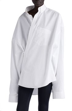 Button-down in collar style only, this asymmetric and voluminous poplin shirt exemplifies designer Demna's aesthetic of fun, but make it fashion. 28" front length, 34" back length (size xs) Slips on over head Button-down collar Long sleeves with button cuffs Chest patch pocket 100% cotton Dry clean or machine wash, line dry Made in Italy Designer Clothing White Oversized Shirt Outfit, Oversized Shirt Outfit, Silk Head Wrap, Oversized Poplin Shirt, Balenciaga Shirt, Designer Clothing Brands, Oversize Women, Wrap Shirt, Cotton Poplin Shirt