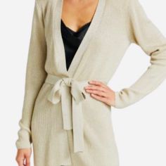 Statement-Making Shoulder Pads Line The Shoulders Of This Ribbed Knit Cardigan With A Belted Waist. V-Neck Long Sleeves Self-Tie Belted Waist 86% Rayon/10% Nylon/4% Metallic Dry Clean Imported Size & Fit About 30" From Shoulder To Hem Model Measurements: 5'10" Tall Model Is Wearing A Us Elegant Beige Knit Sweater Coat, Elegant Knit Sweater Coat For Loungewear, Elegant Wrap Cardigan For Workwear, Elegant V-neck Knit Sweater Coat, Elegant Wrap Cardigan For Work, Elegant Open Front Cardigan For Loungewear, Elegant Open Front Loungewear Cardigan, Elegant Beige V-neck Sweater Coat, Elegant Beige Sweater Coat For Loungewear