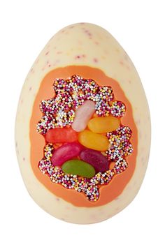 an egg with sprinkles and candies on it