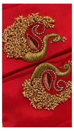 the back of a red dress with gold embroidery on it and an image of a snake