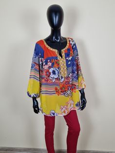 🌸 Embrace timeless elegance with our exquisite Ladies Vintage Elegant Blouse! 🌸 Indulge in the charm of yesteryear with this unique and stylish blouse that effortlessly marries vintage aesthetics with contemporary flair. Adorned with captivating multicolored patterns and a delightful array of flowers in shades of blue, red, and yellow, this blouse is a true masterpiece. The attention to detail is evident in the intricately designed neckline, featuring a captivating blend of patterns and a subt Statement Blouses, Statement Sleeves Blouse, Ladies Blouses, Statement Blouse, Ladies Blouse, Stylish Blouse, Elegant Blouses, Black And White Blouse, Flowy Blouse