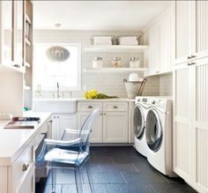 a laundry room with washer and dryer in it