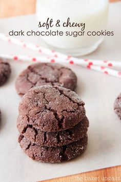 soft and chewy dark chocolate sugar cookies on a table with milk in the background