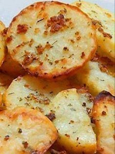 closeup of sliced potatoes with seasoning on them