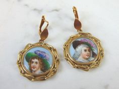 "FOR SALE IS THIS LOVELY VINTAGE 18K YELLOW GOLD HAND PAINTED PORCELAIN EARRINGS. THE EARRING WEIGHS 12.4g. THE EARRINGS MEASURE 1 3/4\" BY 1\". WOULD MAKE A GREAT GIFT FOR THAT SOMEONE SPECIAL. IF ANY QUESTIONS, PLEASE ASK. BE SURE TO CHECK OUT SOME OF OUR OTHER GREAT ITEMS FOR SALE. IF THERE ARE ANY ISSUES PLEASE CONTACT US, WE'RE ALWAYS HAPPY TO TRY TO HELP YOU OUT AS BEST AS WE CAN." Antique Yellow Gold Cabochon Earrings, Victorian Gold Cabochon Earrings, Gold Victorian Cabochon Earrings, Classic Gold Enamel Earrings, Vintage Yellow Gold Collectible Earrings, Vintage Enamel Wedding Earrings, Vintage Round Enamel Earrings, Gold Heart Bracelet, Halo Diamond Earrings