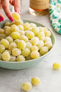 a bowl filled with powdered sugar balls