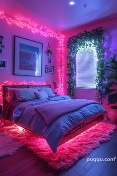 a bedroom decorated in pink and purple with lights on the walls, bedding and rugs