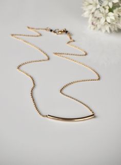 "Gold Bar Necklace, Tube Bead Necklace, Simple Gold Necklace, Minimalist Necklace, Layering Necklace, Gold Filled Necklace, Gift for Her, Mother's Day Gift This modern curved gold tube necklace is a dainty, simple and minimal piece that is perfect to wear everyday. A 14k gold filled curved tube bar glides along a delicate 14k gold filled chain. Necklace secures with a gold filled spring ring clasp. Looks great alone or layered with other necklaces. D E T A I L S: => Metal type - 14 k Gold Fil Simple Gold Necklace, Tube Necklace, Gold Necklace Simple, Gold Filled Necklace, Gold Bead Necklace, Gold Bar Necklace, Necklace Layering, Medallion Necklace, Necklace Simple