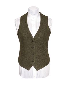 A beautifully fitted green herringbone tweed ladies waistcoat that oozes elegance.It is the perfect handmade Irish garment for any occasion.This colored cloth reflects the landscape of both modern and Celtic Ireland. This four button waistcoat encompasses Irish heritage through its modern take on classic Irish tailoring. The Celtic Tweed ladies collection of tweed waistcoats/vests are our interpretation on timeless Irish design. Our tweed waistcoats offer our wearers a fluid and tailored silhoue Classic Green Vest For Winter, Classic Green Winter Vest, Fitted Tweed Vest With Herringbone Pattern, Elegant Green Tweed Jacket, Elegant Fitted Tweed Vest, Elegant Formal Tweed Vest, Elegant Tweed Vest For Formal Occasions, Women Suit Vest, Waistcoat Women