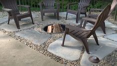 a fire pit with chairs around it