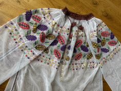 Amazing Romanian vintage blouse!  So beautiful and stunning!  So vibrant colours Tulle fabric Good vintage condition! Universal size Will suit to and S and M and L size Folk Style Tunic Top With Floral Embroidery, Folk Style Floral Embroidered Tunic Top, Bohemian Top With Multicolor Embroidery, Folk Style Festive Tops With Embroidered Border, Traditional Multicolor Embroidered Top With Embroidered Sleeves, Traditional Festive Blouse With Geometric Embroidery, Festive Folk Tops With Embroidered Border, Traditional Tops With Motif For Spring, Festive Traditional Blouse With Geometric Embroidery