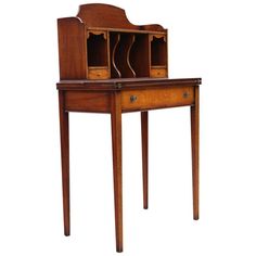 an old wooden desk with drawers on the top and bottom shelf, against a white background