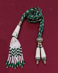 "Adjustable Handmade Necklace Thread, Indian Necklace Jewelry Necklace Cord with Beaded Tassels, Zari Dori Jewelry Supplies.. Bright and beautiful adjustable handmade necklace thread / GREEN necklace cord with beaded tassels and brass lobster clasps. All the colors are Available Only on \"Special Requirement of Buyer\"  ON BULK Purchases Special Discount Shall Also be Provided Depending on Size and lot of Orders.. Also all Colorful Threads are Fully Handmade with Silk Thread..   Buyers Might Also See Slight Variations in Color Like Dark or Light.. Due to Picture Quality.. No Compromise on Our Product On Our Side. Looks good with big pendants or chokers can see in the picture. SIZE: 11 inches can go upto 18 inches ( 9 inches each side ). You Will receive one Piece with One Order We do take Traditional Beaded Lariat Jewelry, Adjustable Tassel Jewelry For Festivals, Traditional Green Long Necklace Beads, Long Traditional Green Necklace, Adjustable Green Beaded Tassel Necklace, Adjustable Tassel Jewelry For Festive Occasions, White Beaded Necklaces With Tassels As Gift, White Beaded Necklaces With Tassels For Gift, Traditional Beaded Necklace With Tassels